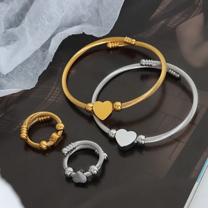 Fashionable gold and silver heart-shaped spiral jewelry set with bracelet and ring