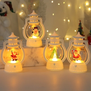 White LED Christmas lantern ornaments with Santa and Snowman prints in warm light