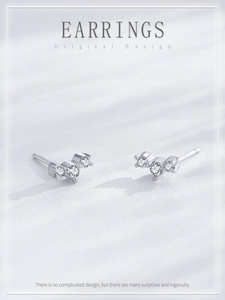 Detailed view of S925 sterling silver studs featuring three tiny sparkling zircons