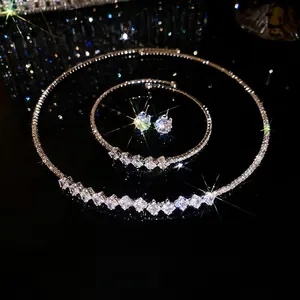 Elegant silver jewelry set with necklace bracelet and earrings featuring sparkling crystals