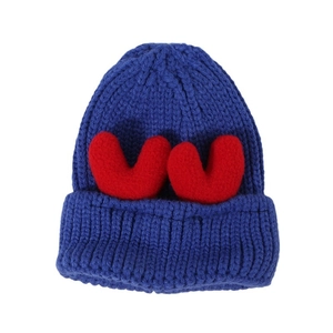 Winter chunky knit beanie in navy blue with cute red plush antler accents for warmth