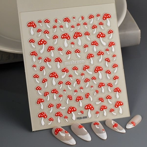 Detailed view of 5D red mushroom nail art stickers with embossed texture on tips