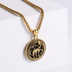 Detailed close-up of retro 18K gold plated Sagittarius zodiac pendant with embossed archer