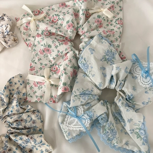 Lace-trimmed floral scrunchies with elegant ribbon bows in various pastel colors