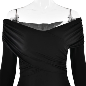 Close-up of black off-shoulder bodysuit with elegant pleated crisscross detail