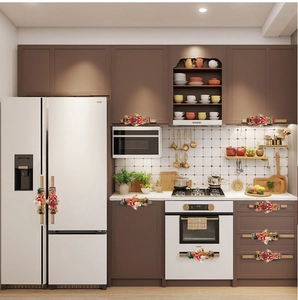 Gingerbread man themed kitchen handle covers decorating various appliances in a kitchen