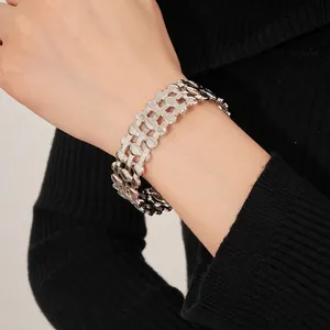 Minimalist silver triple-layered hollow oval bangle with wide woven metal chain texture