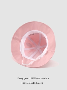 Detail view of pink baby bucket hat showing breathable cotton lining and white windproof strap