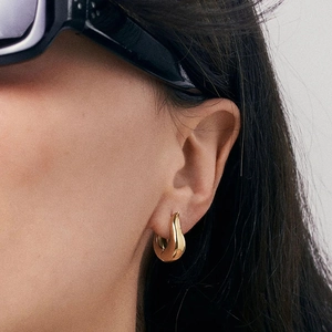 Polished chunky gold hoop earrings with minimalist teardrop design for women