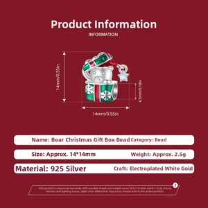 Detail of 925 sterling silver Christmas bear gift box charm with red green enamel finish