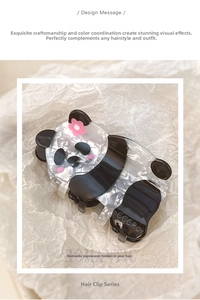 Macro detail of cute panda hair claw clip made of black and white marble acrylic