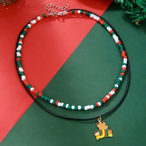 Detail of Christmas beaded necklace with double layers and festive bear gift box pendant