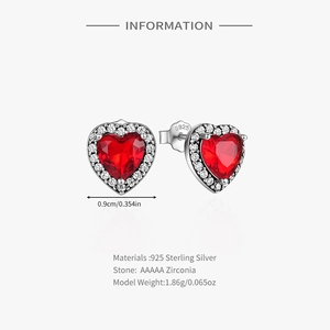 Detailed view of S925 sterling silver heart earrings with red AAA cubic zirconia