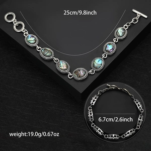 Vintage silver abalone shell bracelet with vibrant waterdrop and round shell charms