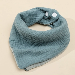 Four-layer cotton muslin baby bib in dark teal and grey with snap buttons
