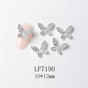 Macro detail of LF7190 mini 3D butterfly nail charms with rhinestones and 10x13mm size