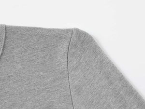 Detail of shoulder stitching and knit texture on gray modal stretch long sleeve top