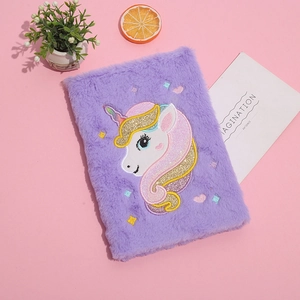 Plush purple unicorn notebook with colorful embroidery on a soft fuzzy cover