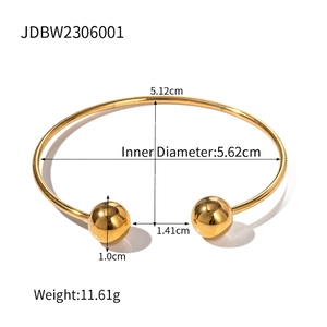 Polished gold stainless steel open bangle with double metal spheres and mirror finish