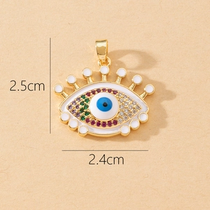 Detailed macro view of an Evil Eye pendant with colorful zircons and 2.5cm dimensions
