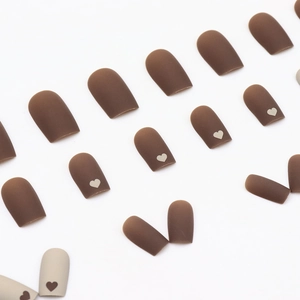 Short square matte nails in milk coffee tones featuring minimalist heart designs