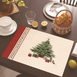 Linen Christmas placemat with festive tree and gift pattern on dark wood dining table