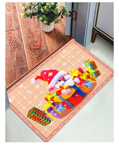 Detailed view of orange checkered Christmas Santa floor mat with gift boxes at a doorway