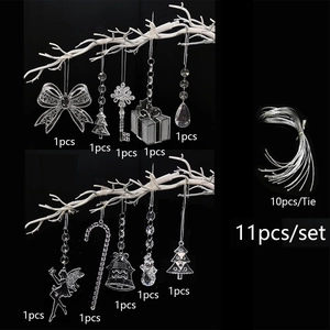Detail view of 11-piece clear acrylic Christmas ornament set with silver hanging strings