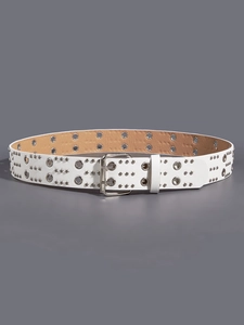 Detail of white leather punk belt with double rows of silver metal eyelets and dual pin buckle
