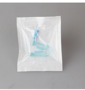 Close-up of a disposable sterile ear piercing gun in a sealed transparent bag