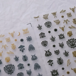 Embossed retro totem nail art stickers with gold and black mystical skull patterns