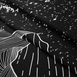 Detail of starry night and mountain waves print on high-density decorative fabric