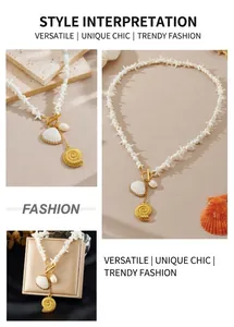 Close-up of bohemian starfish beaded necklace with gold shell pendants and OT toggle clasp