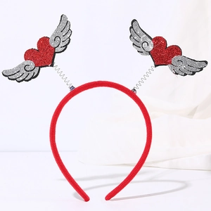 Close-up of red sequined heart headband with silver wings on spring festive party accessory