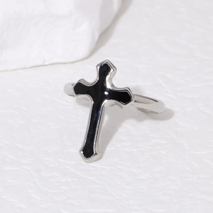 Retro stainless steel ring with a black cross oil drip design on a textured stone base