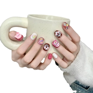 Handmade short press-on nails with 3D donuts and pink bear charms in sweet girl style