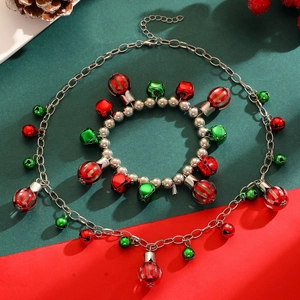Detailed top view of Christmas jewelry set with festive red and green jingle bell charms