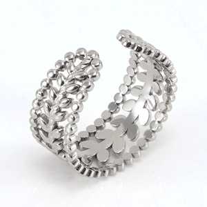 Detail view of adjustable silver leaf ring with hollowed olive branch and micro bead edge