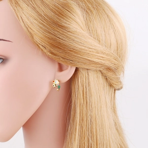 Detail of colorful mermaid tail earrings with opal and cubic zirconia on model