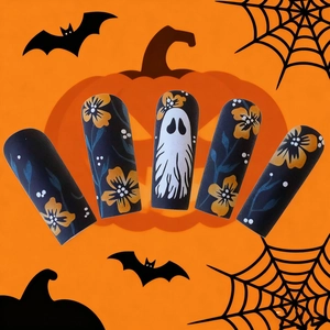 Halloween press-on nails with white ghosts and yellow flowers on a matte black base