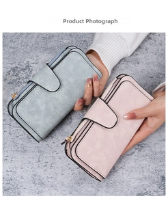 Detailed view of long wallets in pink and blue grey with buckle and zip closure