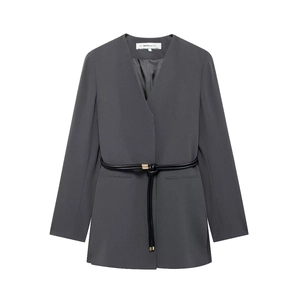 Detail of dark grey collarless blazer featuring a black rope belt with gold metal tips