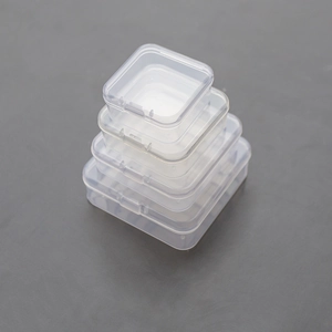 Vertical stack of four transparent plastic storage boxes in different rectangular sizes