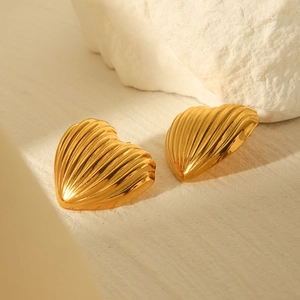 18K gold plated stainless steel heart earrings with textured wave pattern on white stone