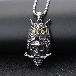 Vintage owl skull pendant in polished stainless steel with yellow gemstone eyes
