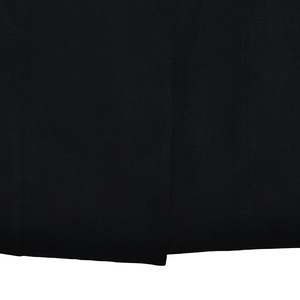 Close-up of black tight-woven fabric texture showing high-quality garment material detail