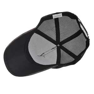 Close-up of internal mesh structure and cotton washing label inside the baseball cap