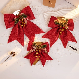 Set of three glittery red Christmas bows with pine needles and berries for tree decor