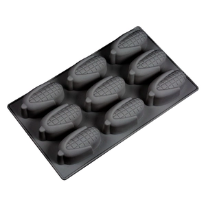 Detailed close-up of dark grey silicone mold with 8 corn-shaped cavities for DIY baking