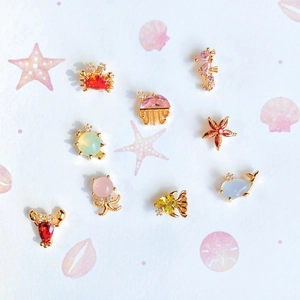 Golden sea animal charms set with colorful zircon including seahorse crab and turtle